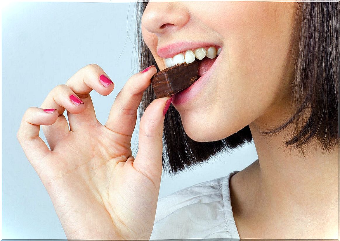 Woman eating chocolate