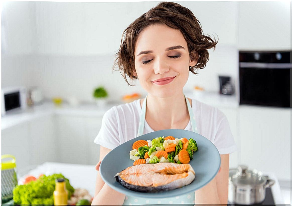 Woman eating salmon