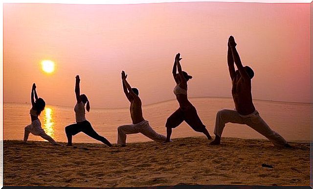 people practicing Tai-Chi at sunset