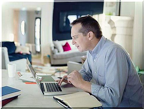 Man at computer representing recommendations for teleworking