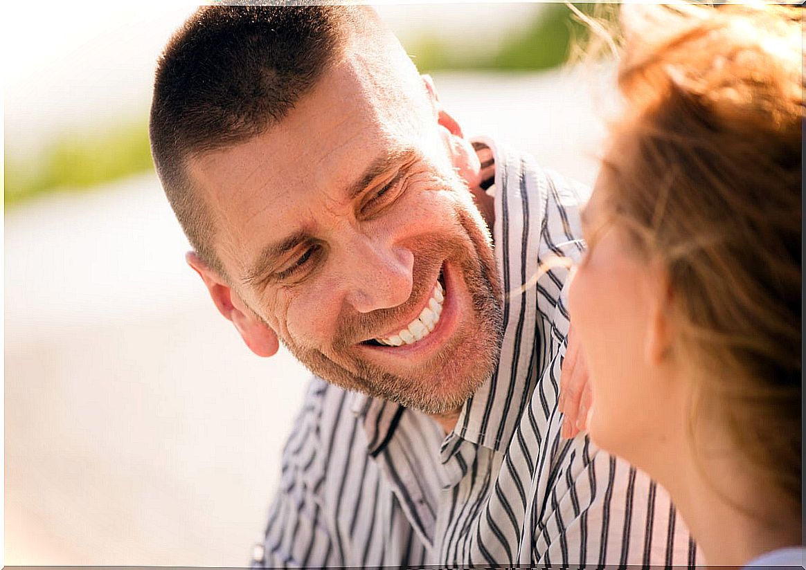 man talking to woman representing if we are born optimistic