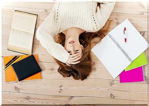 Woman lying on the floor with stress