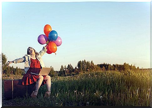 Laughing woman with balloons 