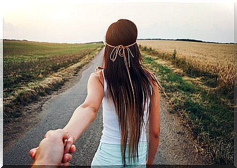 Hand of a boy holding that of his partner