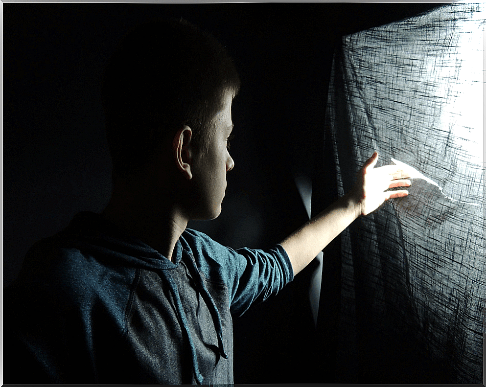 Man looking out of a window