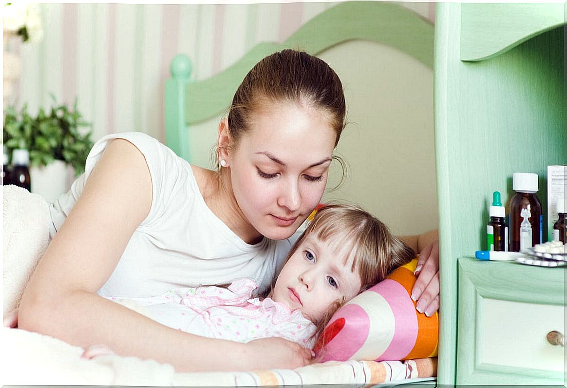 Mother with her daughter in bed