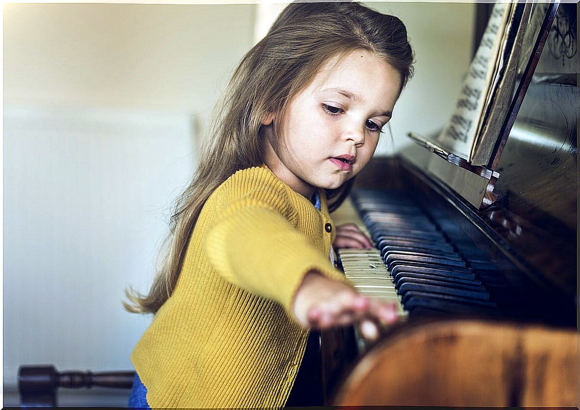 Little girl playing the piano