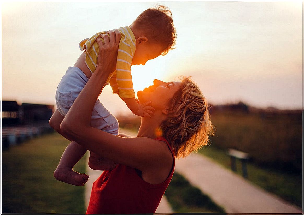 Mother holding her son representing emotionally intelligent families