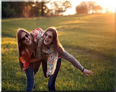 Girlfriends smiling in the field