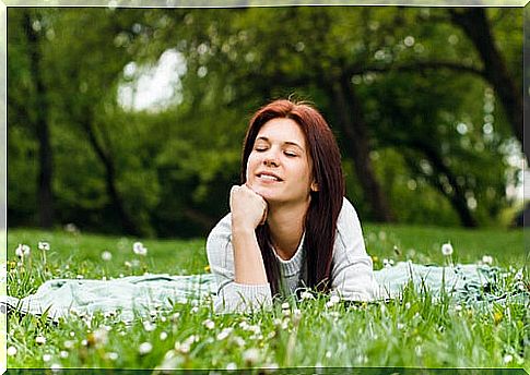 Woman thinking about the grass