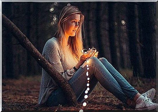 girl in the forest with light thread trying to solve conflicts