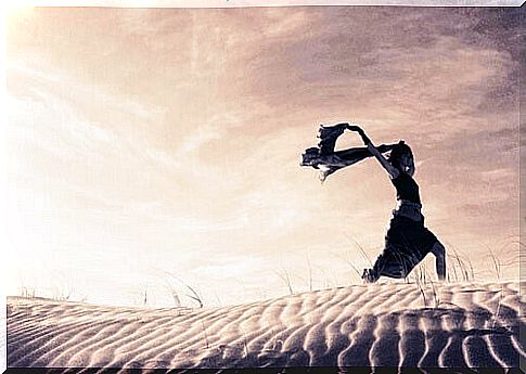 Woman running through the desert