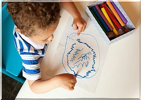 Boy drawing doodles on paper