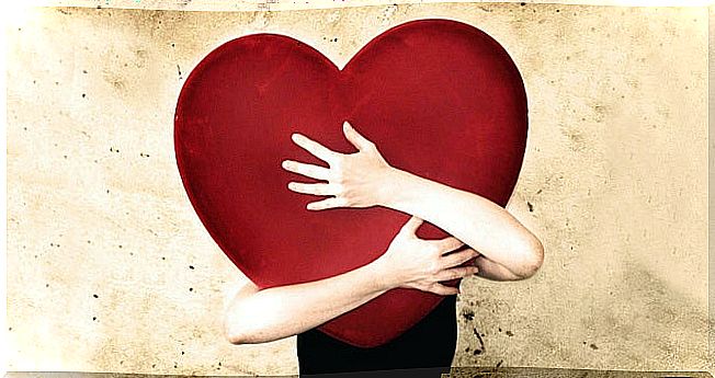 Person hugging a heart