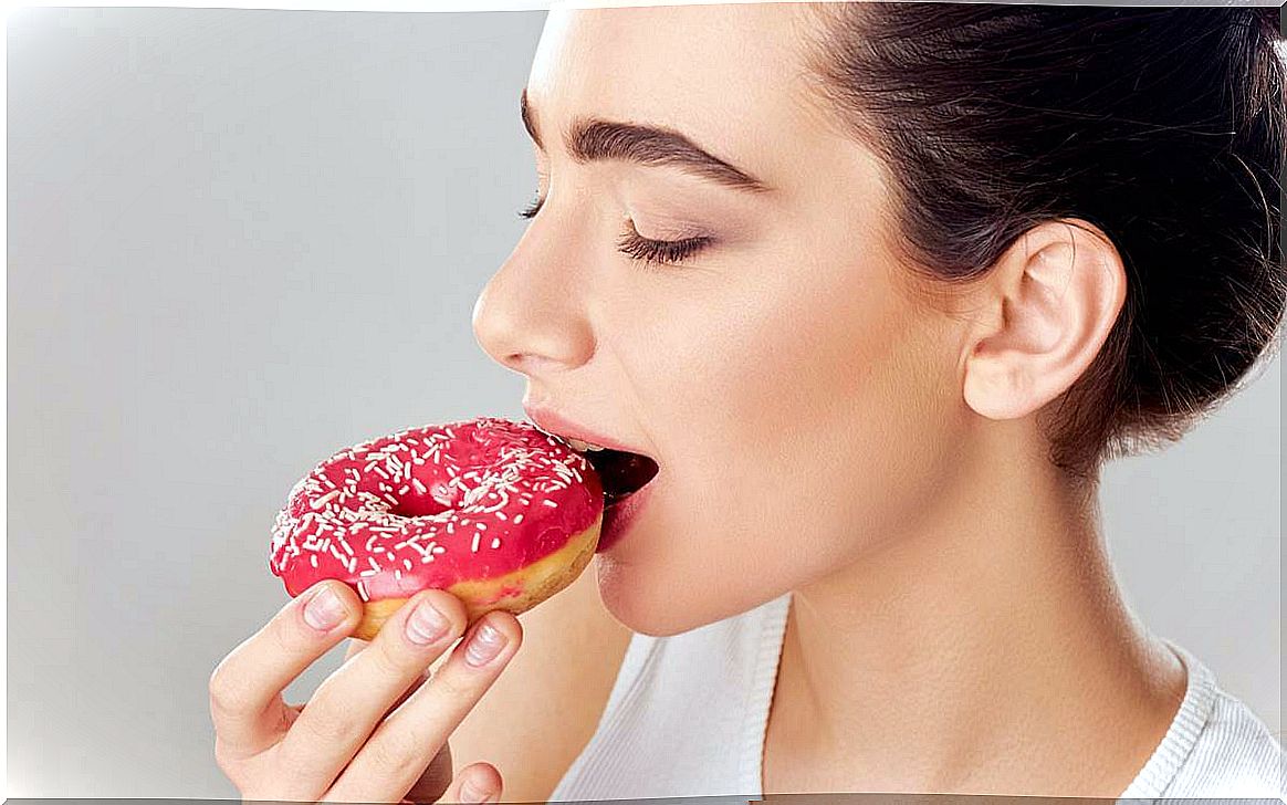 Woman eating donut