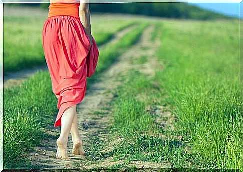 Woman moving along footpath