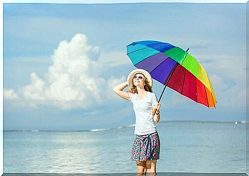 Happy woman with umbrella