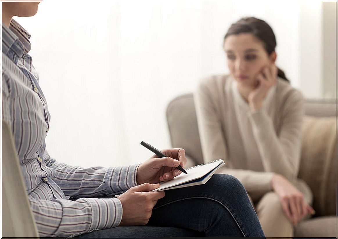 Psychologist doing therapy to a young girl