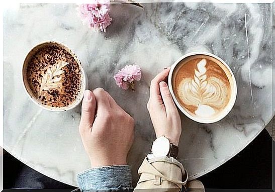 two people drinking coffee