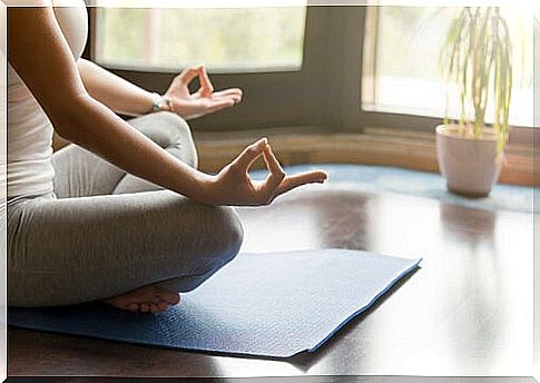 Woman meditating in her room