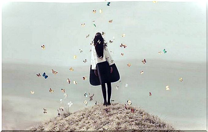 young girl surrounded by butterflies